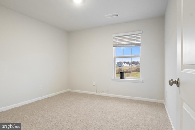 spare room featuring carpet flooring