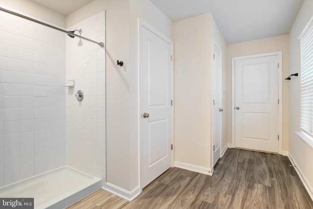 143 Knobby Hook, Hanover, PA 17331 - bathroom featuring wood finished floors, a tile shower, and baseboards