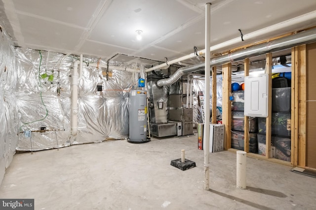 basement featuring heating unit and water heater