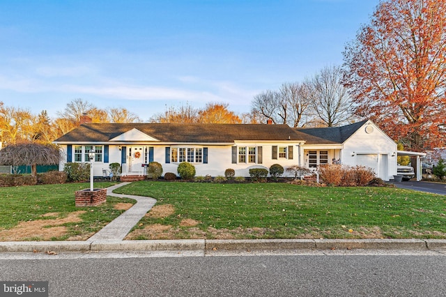 single story home featuring a front yard and a garage