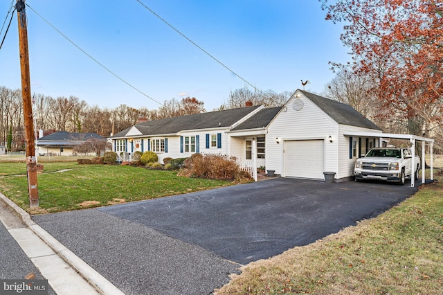 single story home featuring a garage and a front lawn