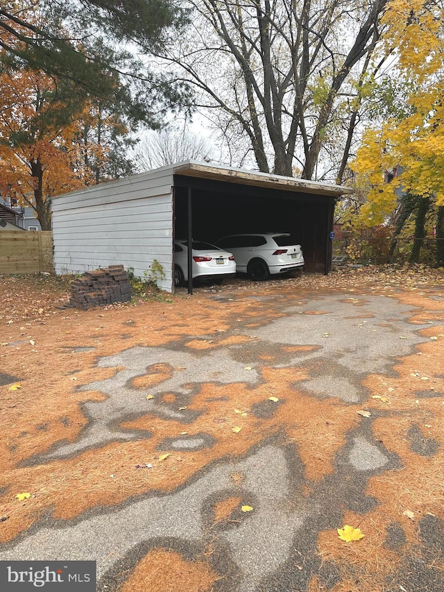 view of outbuilding with a carport