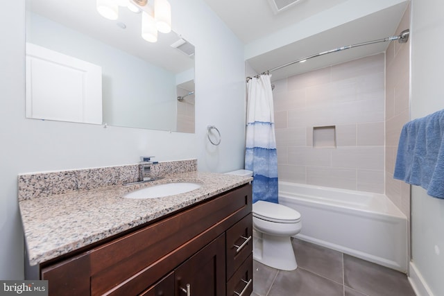 full bathroom with tile patterned floors, vanity, toilet, and shower / bath combo with shower curtain