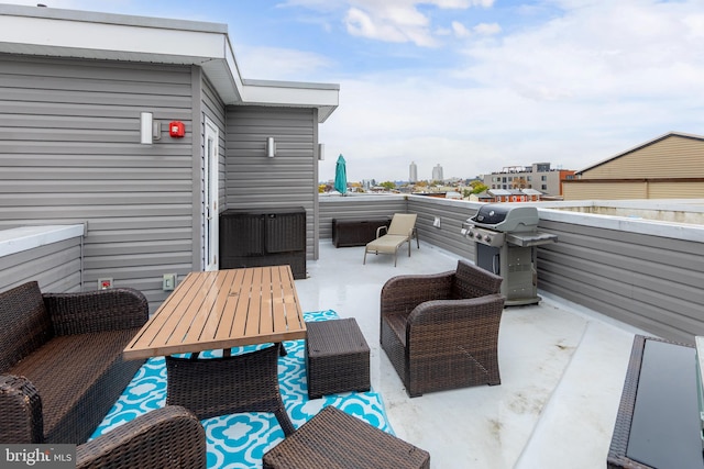 view of patio with a grill, a balcony, and an outdoor hangout area