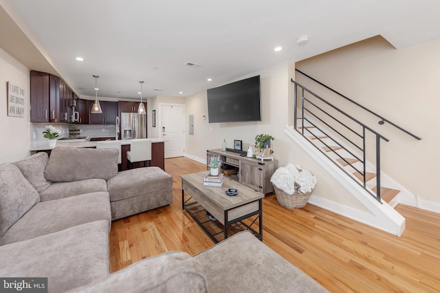 living room with light hardwood / wood-style flooring