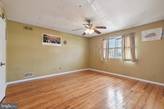 unfurnished room featuring ceiling fan and light hardwood / wood-style flooring