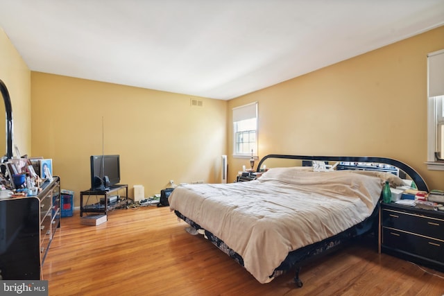 bedroom featuring wood-type flooring