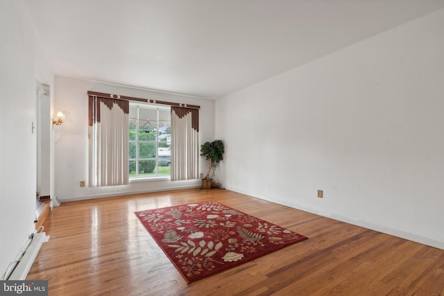 spare room featuring light hardwood / wood-style floors