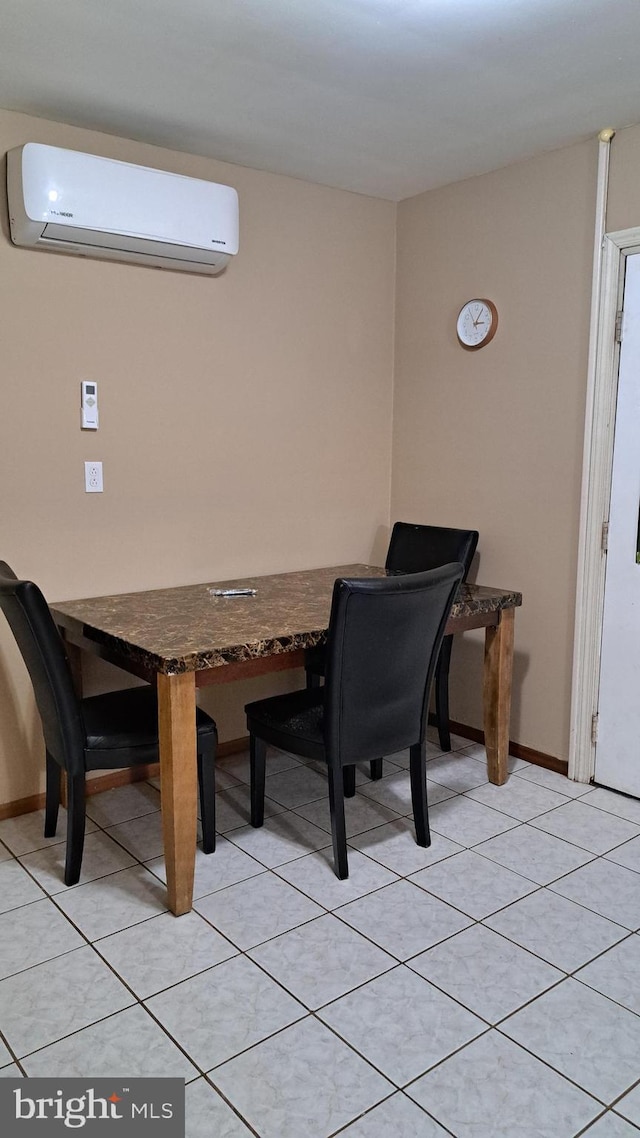 tiled dining space with a wall mounted AC