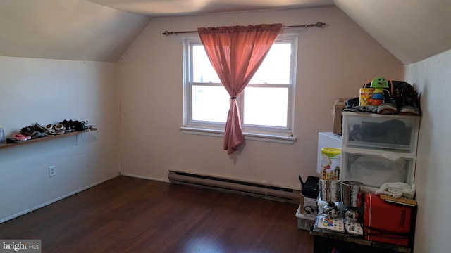 bonus room featuring vaulted ceiling, dark wood-type flooring, and a baseboard heating unit