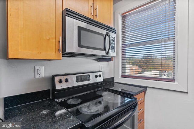 kitchen with black range with electric cooktop