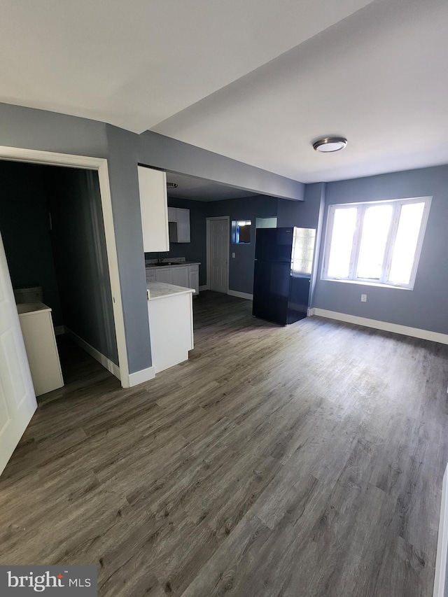 kitchen featuring white cabinets and dark hardwood / wood-style floors