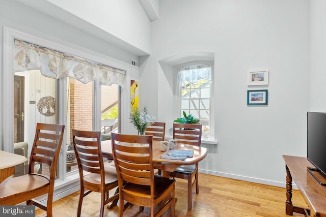 dining space featuring light wood-type flooring