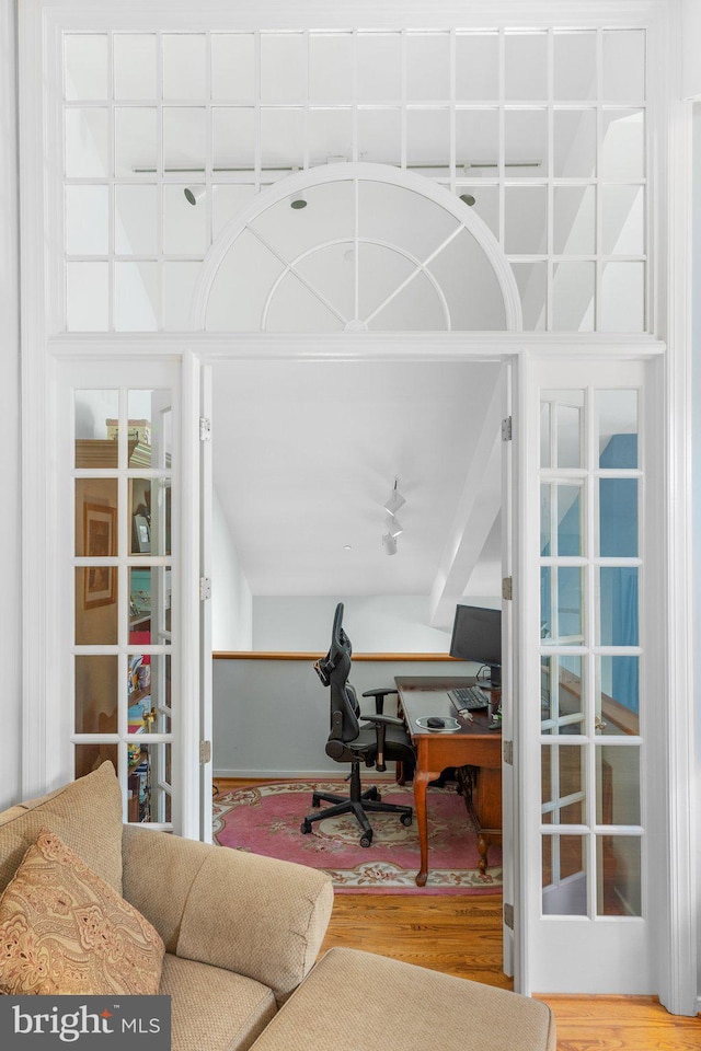 office space with hardwood / wood-style flooring and french doors