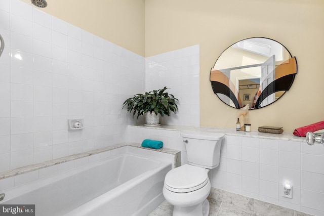 bathroom with toilet and a bathtub