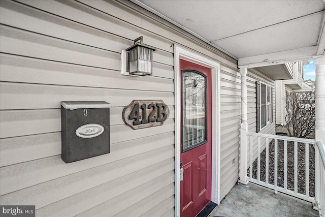 doorway to property with a porch