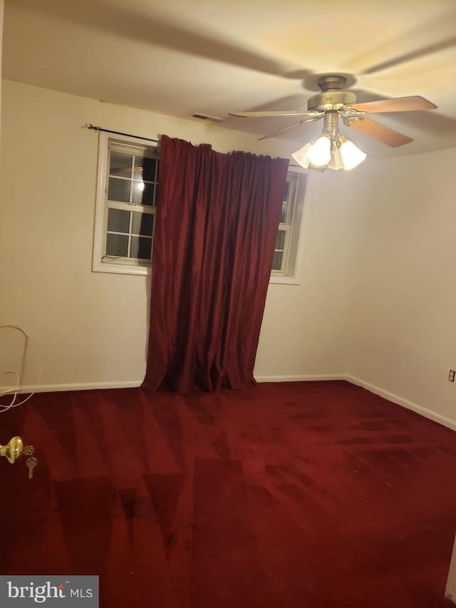 spare room featuring ceiling fan