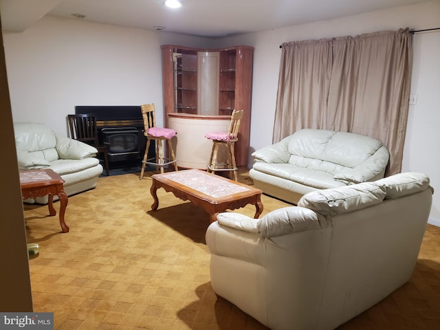 living room featuring a wood stove