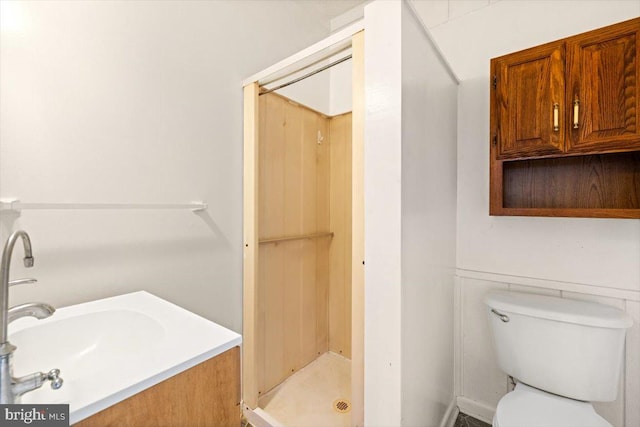 bathroom with toilet and a shower