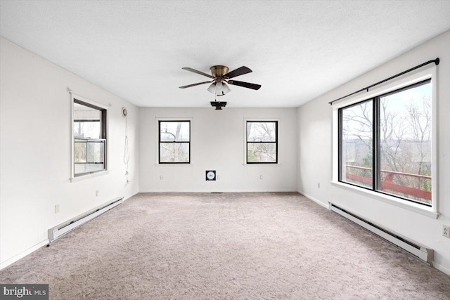 unfurnished room featuring baseboard heating, ceiling fan, and carpet flooring