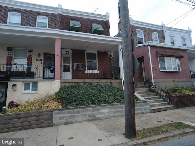 view of property featuring a porch