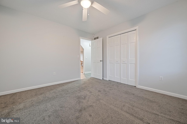 unfurnished bedroom featuring carpet, a closet, and ceiling fan