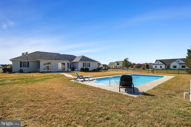 view of pool featuring a yard and a patio