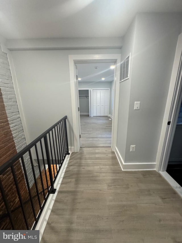 corridor featuring wood-type flooring