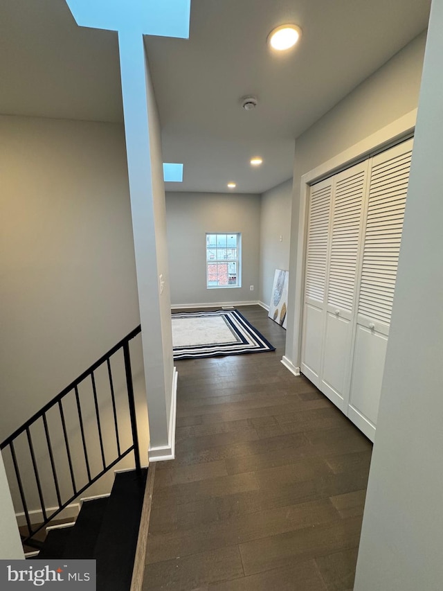 hallway featuring dark hardwood / wood-style floors