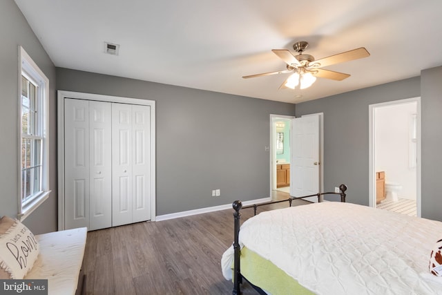 bedroom with ensuite bathroom, a closet, ceiling fan, and wood-type flooring