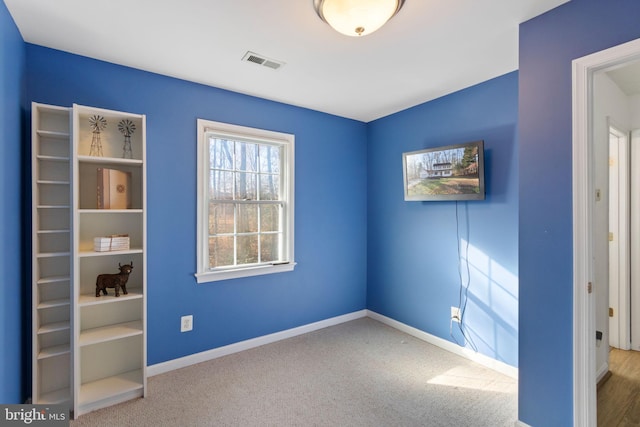 empty room featuring carpet flooring