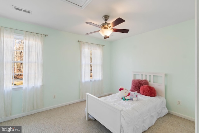 bedroom with ceiling fan and light colored carpet