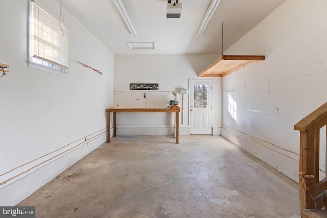 basement with a workshop area and plenty of natural light