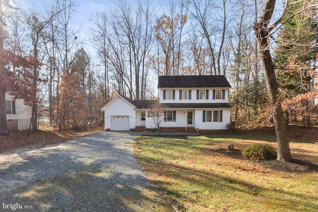 view of front facade featuring a garage and a front lawn