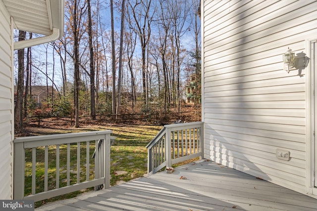 wooden terrace with a yard