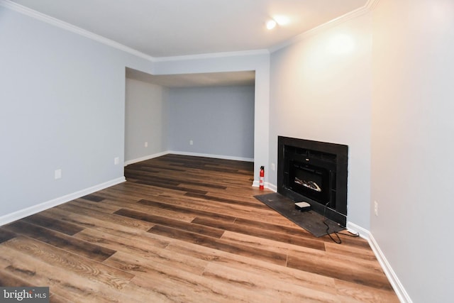 interior space featuring dark hardwood / wood-style flooring and ornamental molding