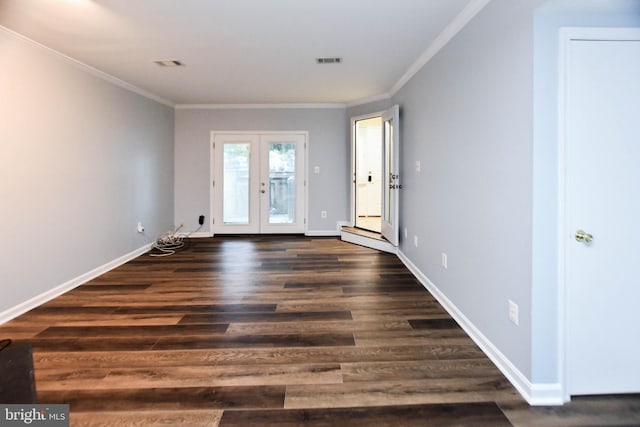 spare room with french doors, dark hardwood / wood-style flooring, and ornamental molding