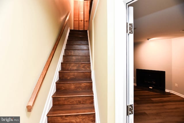 staircase featuring hardwood / wood-style flooring