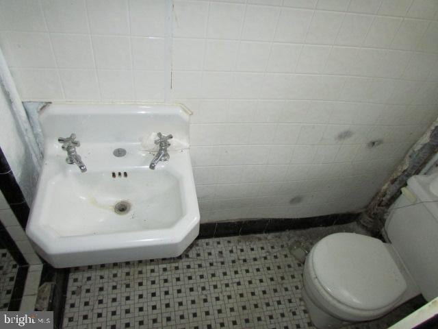 bathroom with tile patterned floors and toilet