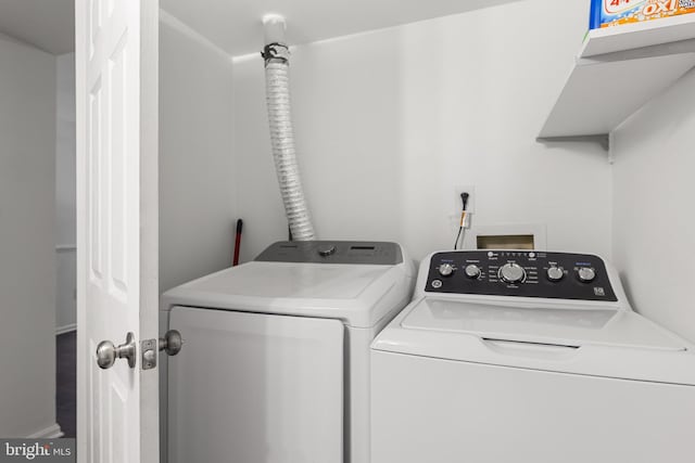 washroom with independent washer and dryer