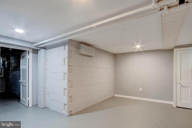 basement featuring an AC wall unit