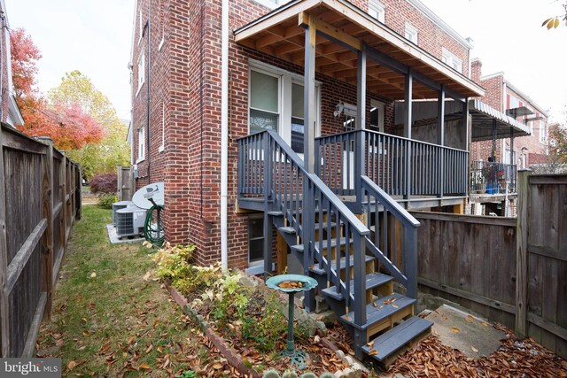 526 Powhatan Pl NW, Washington, DC 20011 - back of property with brick siding, a fenced backyard, and central AC unit