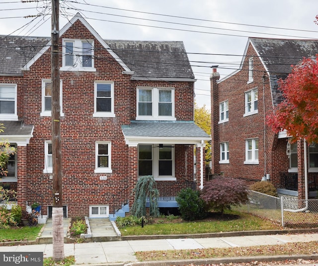 526 Powhatan Pl NW, Washington, DC 20011 - view of front facade with brick siding, covered porch, and roof with shingles