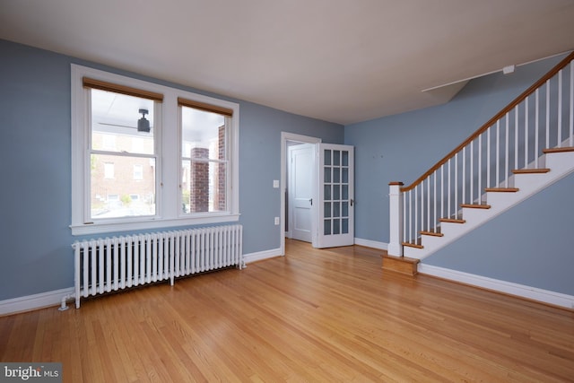 526 Powhatan Pl NW, Washington, DC 20011 - foyer with radiator, wood finished floors, baseboards, and stairway