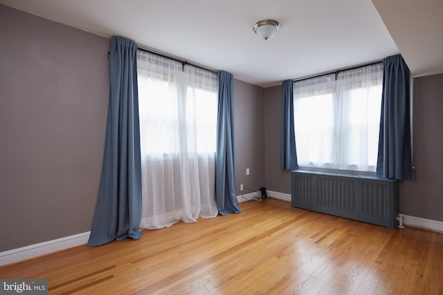 526 Powhatan Pl NW, Washington, DC 20011 - spare room with radiator, plenty of natural light, and baseboards