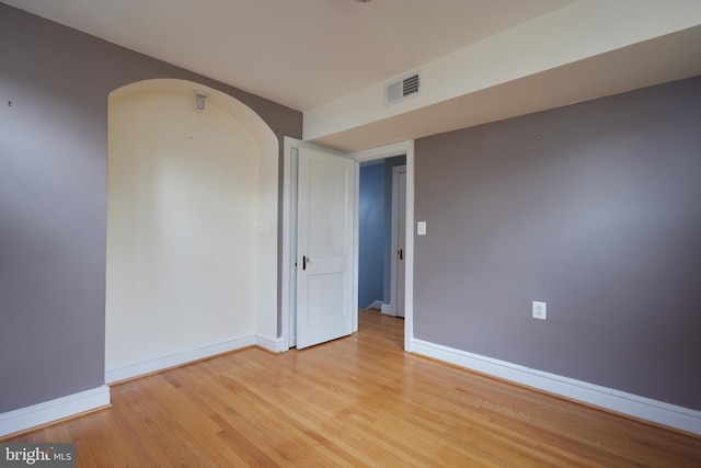 spare room with light wood-type flooring