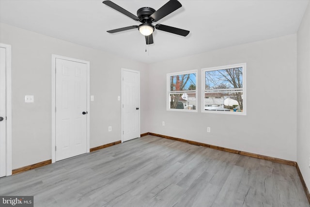 unfurnished bedroom featuring ceiling fan and light hardwood / wood-style flooring