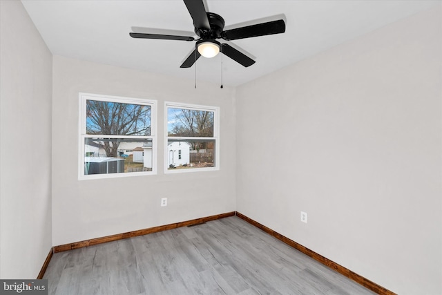 unfurnished room featuring ceiling fan and light wood-type flooring