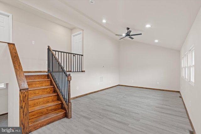 interior space featuring vaulted ceiling, light hardwood / wood-style flooring, and ceiling fan