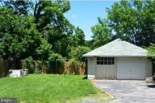 garage featuring a lawn